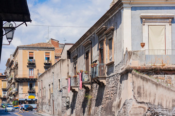Travel to Italy -  historical street of Catania, Sicily, facade of ancient buildings
