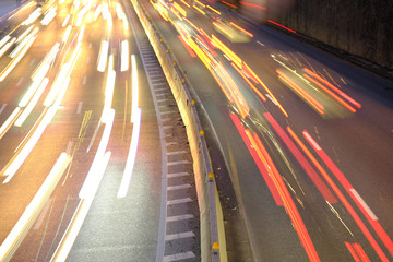 The car light trails on the highway in the night modern city