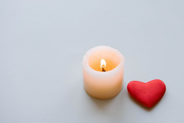 Burning candle and heart. 