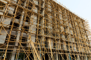 Construction scaffold made from bamboo tree covered the new building