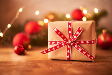 christmas gift with ribbon and bow on red background