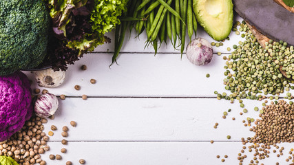 Winter vegetarian, vegan food cooking ingredients,white wooden background, top view,.with different...