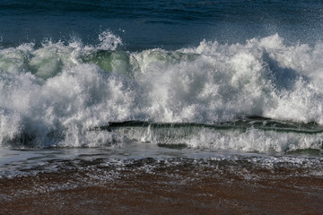 Splashing Atlantic ocean wave, Nazare, Portugal.