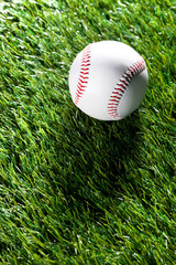 a baseball on the grass