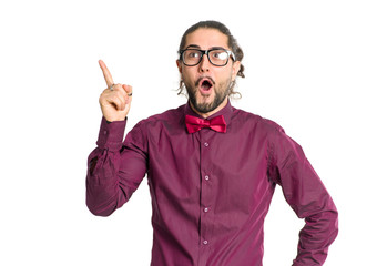 Portrait of cheerful smiling man in shirt and bow tie showing up isolated on white background.