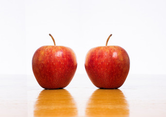 Two Red Apples on White
