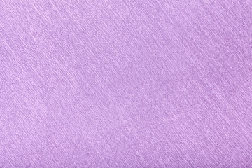 Textural of lilac background of wavy corrugated paper, closeup.