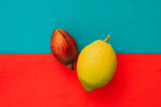 Fototapeta Whole tamarillo and lemon on bright background