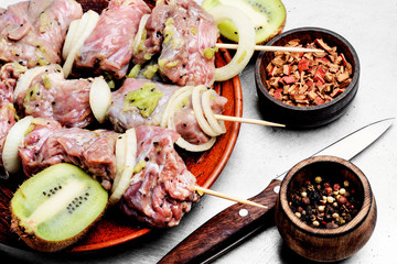 Raw beef shish kebab on skewers