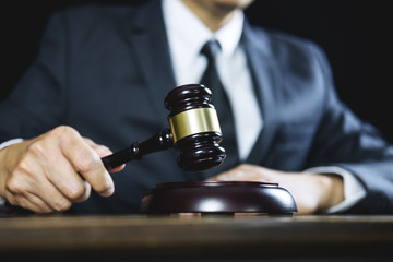 Counselor or Male lawyer working on courtroom sitting at the table. Legal law, Judge gavel with...