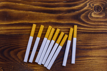 Tobacco cigarettes on wooden table