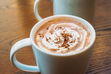 Hot cocoa and chocolate in white cup or mug