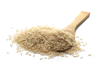 Integral brown long rice pile with wooden spoon isolated on white background