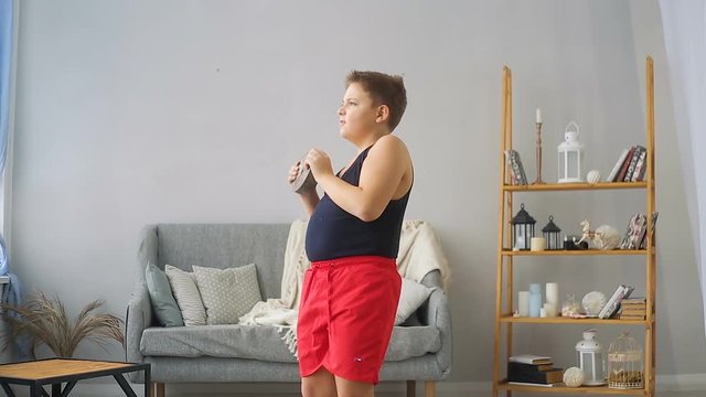 Fat boy lifts a weight