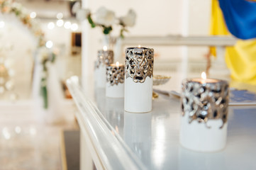 vases with candles stand for wedding ceremony