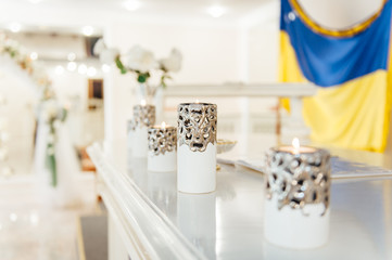 vases with candles stand for wedding ceremony