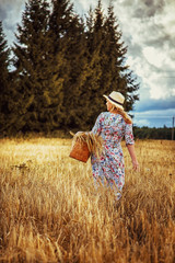 Beautiful blond girl  in a wheat field.