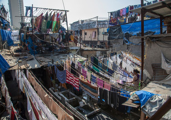 Fototapeta na wymiar The huge outdoor laundry.Mumbai.India.26-01-2018.Thousands of articles are washed, dried and ironed every day.