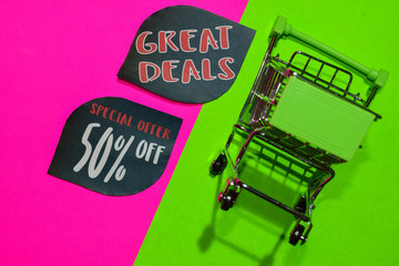 Special Offer 50% Off and Great Deals Text and Shopping cart. Discount and promotion business concept on colorful background