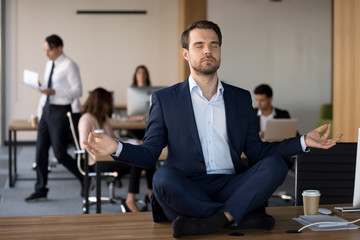 Business People working in coworking space, focus on millennial peaceful employee in formal suit...