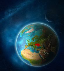 Obraz premium Ukraine from space on planet Earth in space with Moon and Milky Way. Extremely fine detail of planet surface.