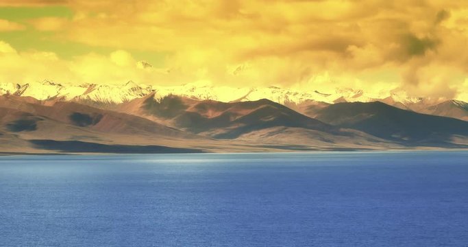 4k time lapse of huge clouds mass rolling over lake namtso & Tanggula snow mountain peak,tibet mansarovar,Tibet's second largest lake,is the third largest saltwater lake in China.
