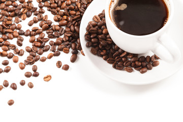 Cup of strong coffee in roasted coffee beans on white background, isolated