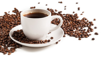 Cup of strong coffee in roasted coffee beans on white background, isolated