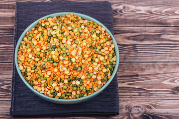 The concept of natural healthy food. Mix of various legumes in a large ceramic cup