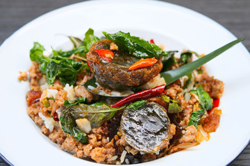 Basil leave with minced pork and fried preserved egg