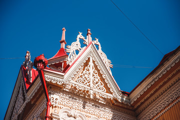 Wooden house with carving against the blue sky, Tomsk, Russia