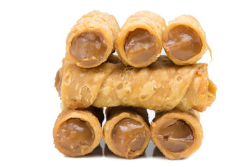 Traditional Brazilian pastry candy called canudinho close in white background