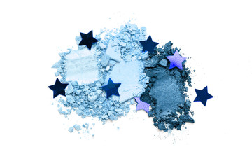 A broken blue gradient colored eye shadows isolated on a white background. Top view, flat lay. Copy space for your text
