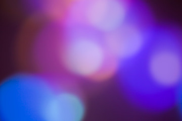 Magic lights christmas bokeh on black background. Can be used for your photos.