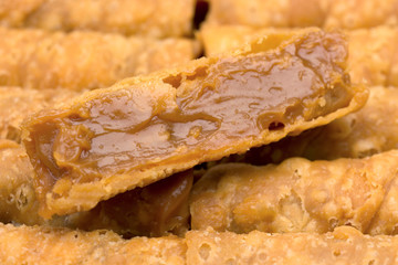 Traditional Brazilian pastry candy called canudinho over other candies