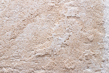 Rough weathered natural old stone wall background, various colored