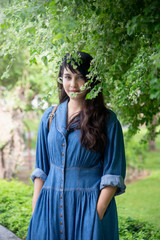 Fashion girl outdoor portrait, Asian woman walking in the park.