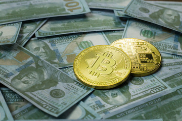 Cryptocurrency Bitcoin on dollar banknote close up image.