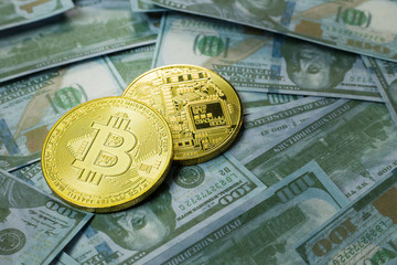 Cryptocurrency Bitcoin on dollar banknote close up image.