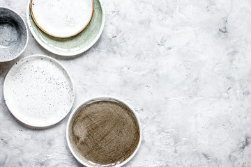 ceramic tableware top view on stone background mock up