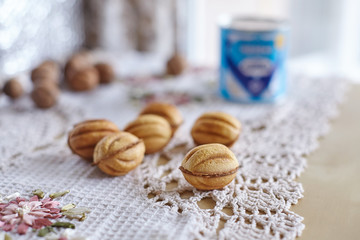 Traditional russian festive cookies in nut shape with caramelized milk inside