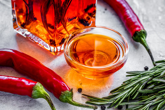 natural oils concept with fresh chili paper on table background