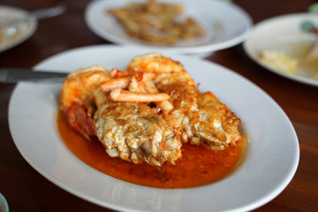 Fresh river prawn stir fried with chili and salt serving on the white plate