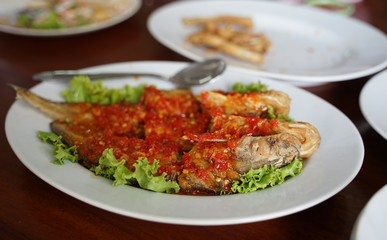 Fresh Whisker Sheaifish deep fried and put chili sauce on top
