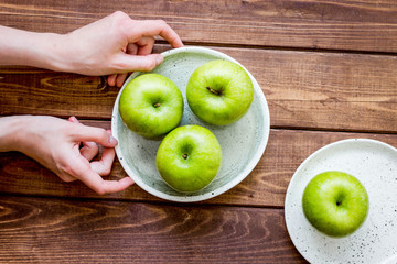 ripe green apples wooden table background top view