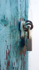 padlock on an old wooden door
