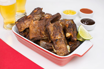 Fried pork rib in a white pub table