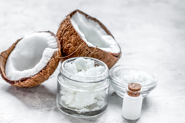coconut oil for body care in cosmetic concept on white desk
