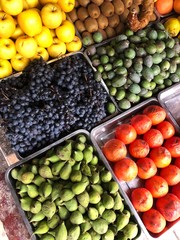 The grapes figs and persimmons in the market 