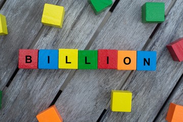 colored wooden cubes with letters. the word billion is displayed, abstract illustration